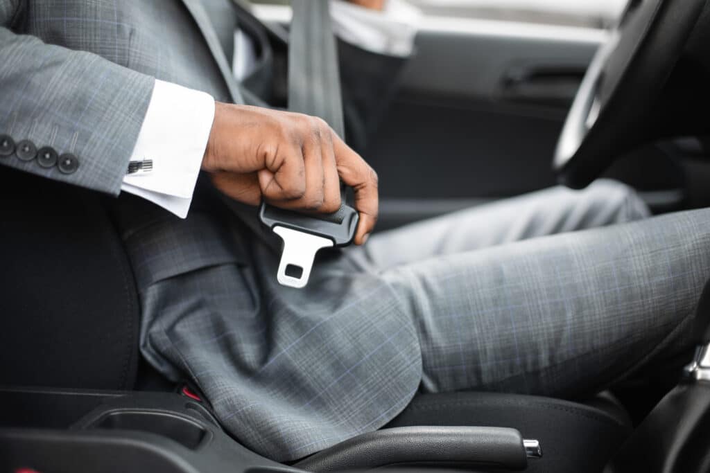 Driving,Safety,Concept.,Unrecognizable,Black,Businessman,Fasten,Seat,Belt,In